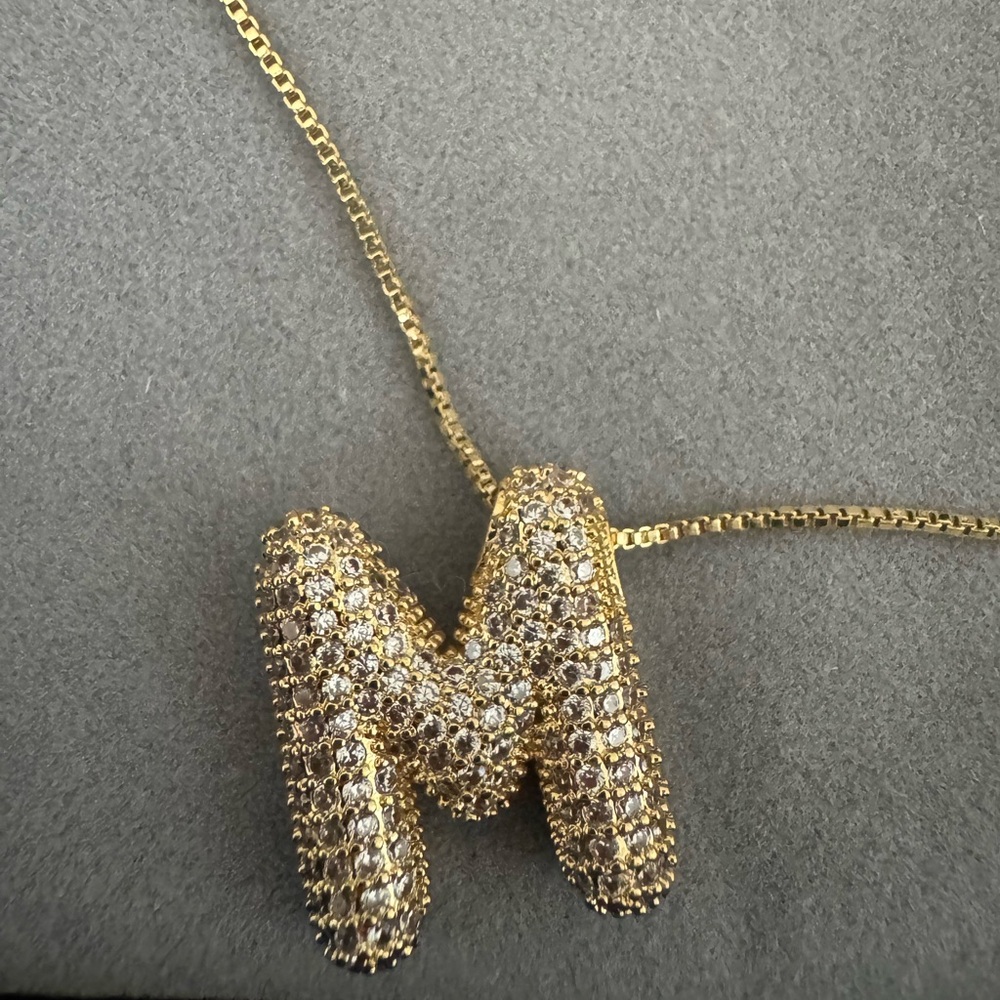 New gold toned bubble “M” initial necklace.
